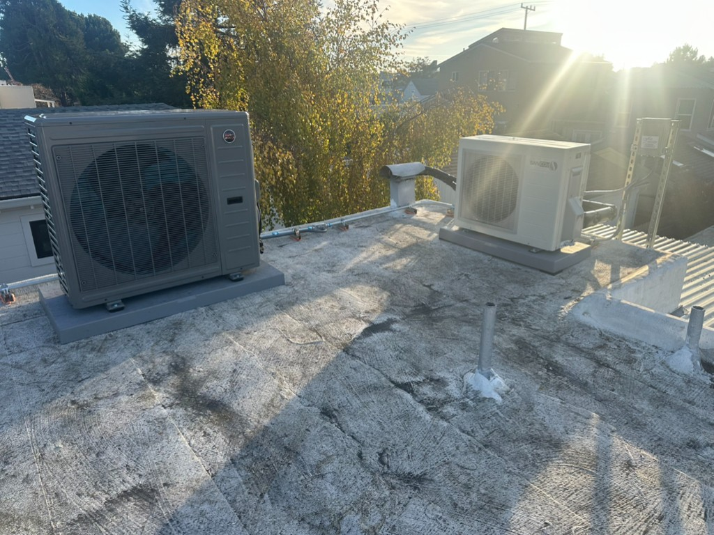 Multi-family rooftop condensing units installed by Air Synergy on a Bay Area property, photographed at sunrise
