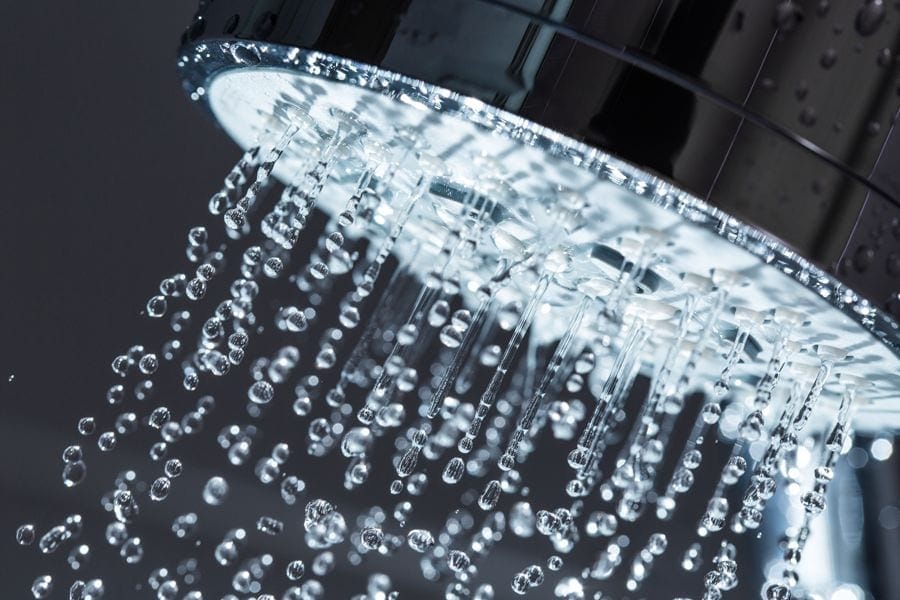 Image of water running out of shower head. 7 Things You Should Know About Tankless Water Heaters.