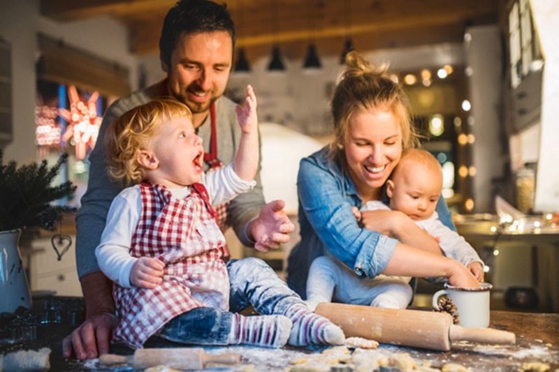 6 ways your furnace keeps you safe, family of four happily baking together