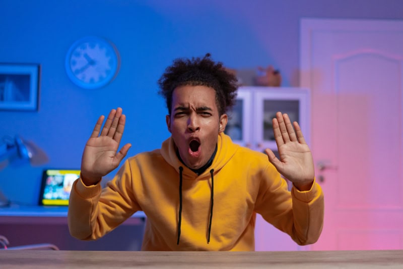 Young male youtuber making another video for his audience.