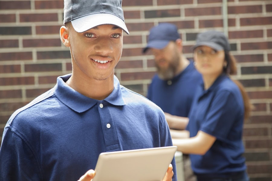 Young black technician with his iPad.