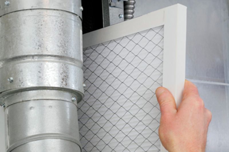 A furnace filter is being installed. What Are Furnace Filters?